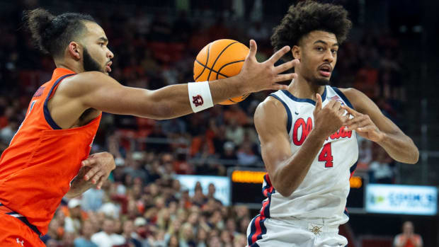 Auburn Tigers forward Johni Broome (4) steals the ball from Ole Miss Rebels forward Jaemyn Brakefield (4) as Auburn Tigers take on Ole Miss Rebels at Neville Arena in Auburn, Ala., on Wednesday, Feb. 22, 2023.